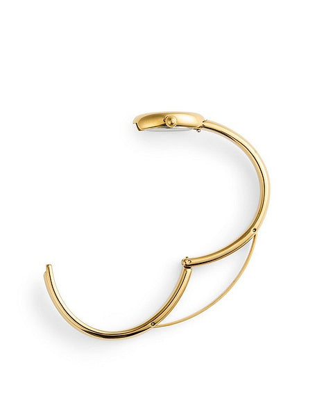 En tydlig illustrationsbild som visar låsmekanismen och öppningen på det stela bangle-armbandet till Mockberg Belle Oval Petite Gold.