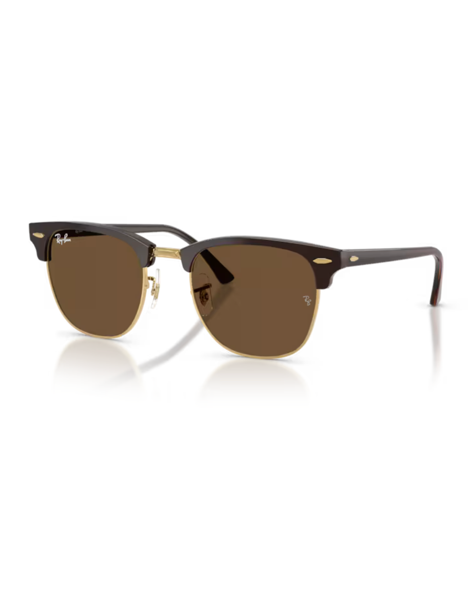 Ray-Ban Clubmaster aurinkolasit ruskealla ja kultaisella kehyksellä sekä tummanruskeilla mineraalilasilinsseillä.