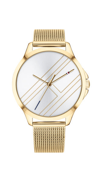 Tommy Hilfiger Peyton TH1781962 damklocka har en rund, silverfärgad urtavla med en stor guldfärgad Tommy Hilfiger- logo och guldfärgade visare. Boetten och remmen är också guldfärgade.