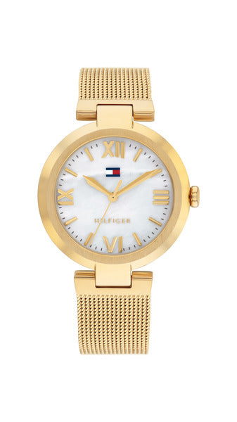 Tommy Hilfiger Alice TH1782634 damklocka har en rund urtavla i pärlemor med guldfärgade romerska siffror och visare. Ramen, boetten och remmen är också guldfärgade.