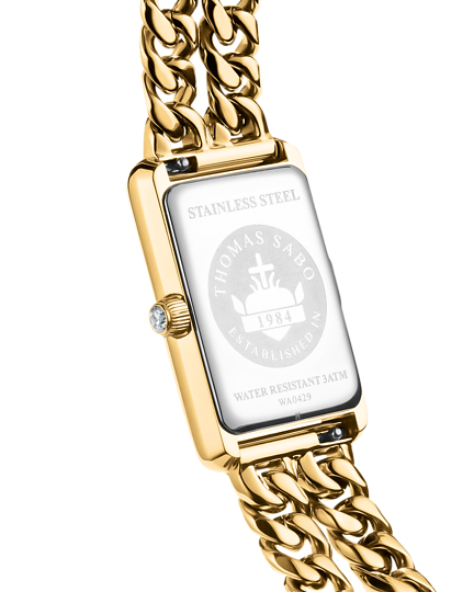 Lähikuva kullanvärisen Thomas Sabo WA0429 -naistenkellon kiillotetusta takakannesta, johon on kaiverrettu mallitiedot ja brändin logo.