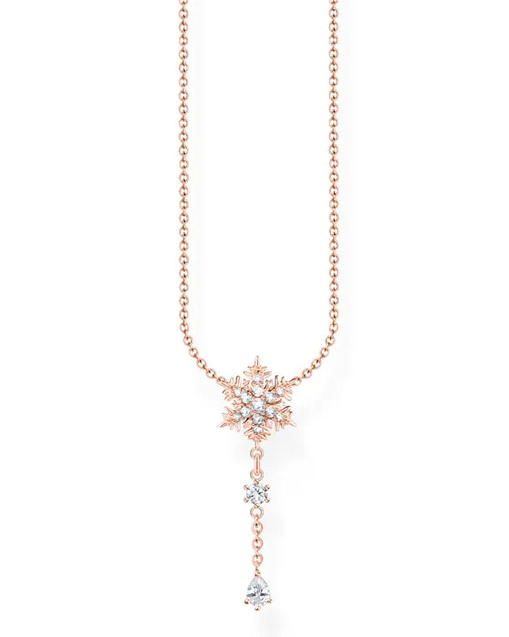 Thomas Sabo Charming Polar World KE2171-416-14-L45 halsband med tunn roséguld-pläterad silverkedja och snöflingehänge dekorerat med zirkoner. Från hänget hänger en kedja med två zirkoner.