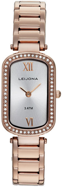 Leijona Tola 5170-4458 damklocka har en rektangulär, silverfärgad urtavla med runda hörn, roséguldfärgade romerska index på klockan sex och tolv, samt roséguldfärgade visare. Ramen är roséguldfärgad och dekorerad med strass. Boetten och remmen är också roséguldfärgade.