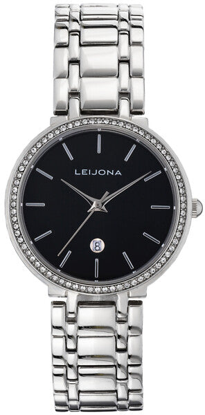 Leijona Hoods Malmi 5172-4081 damklocka har en rund, svart urtavla med silverfärgade index och visare. Ramen, boetten och remmen är silverfärgade. Ramen är dekorerad med strass.