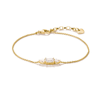 Kullanvärinen 18K keltakullattu Thomas Sabo -rannekoru kirkkailla zirkoniakivillä.